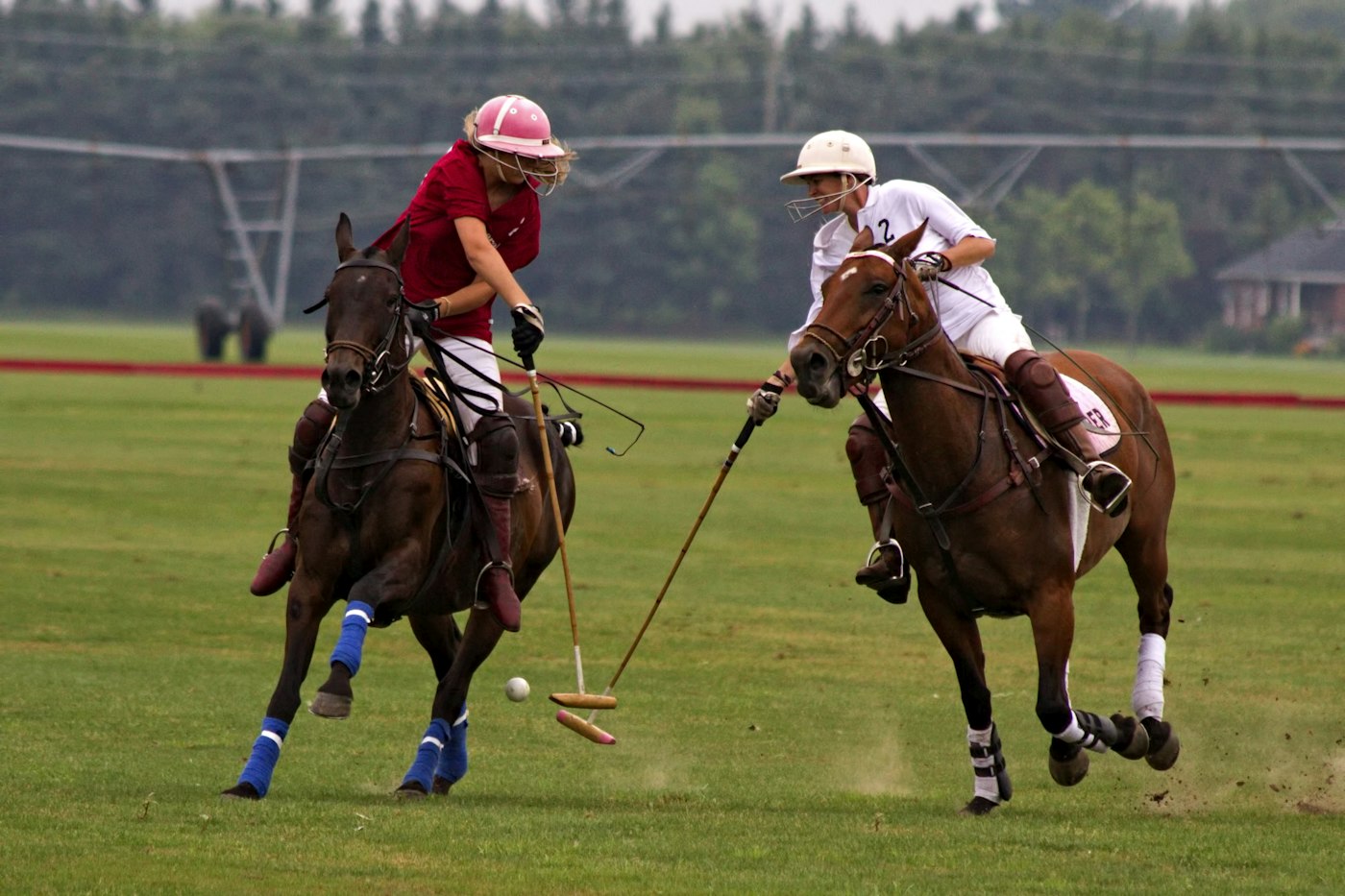 Two polo players riding off for the ball